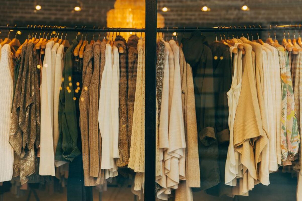 Racks of neatly hung clothing in the thrift store